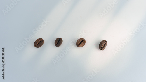  Roasted coffee beans are blackish brown, with a white background