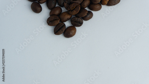  Roasted coffee beans are blackish brown, with a white background