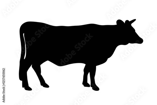 A cow stands strong, a symbol of resilience and simplicity. Nature's quiet beauty in a single silhouette