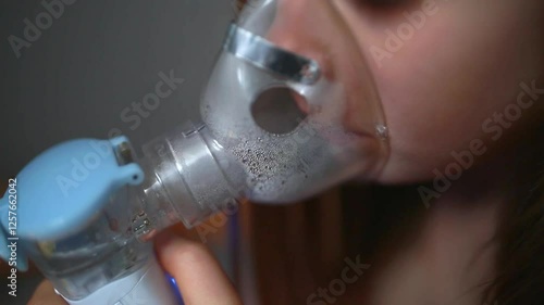 Wallpaper Mural Cute little baby in the mask of an inhaler. Procedure of inhalation at home. Baby taking respiratory therapy with nebulizer. Torontodigital.ca