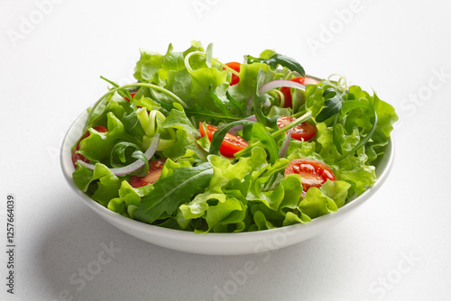 Fresh green salad on white background