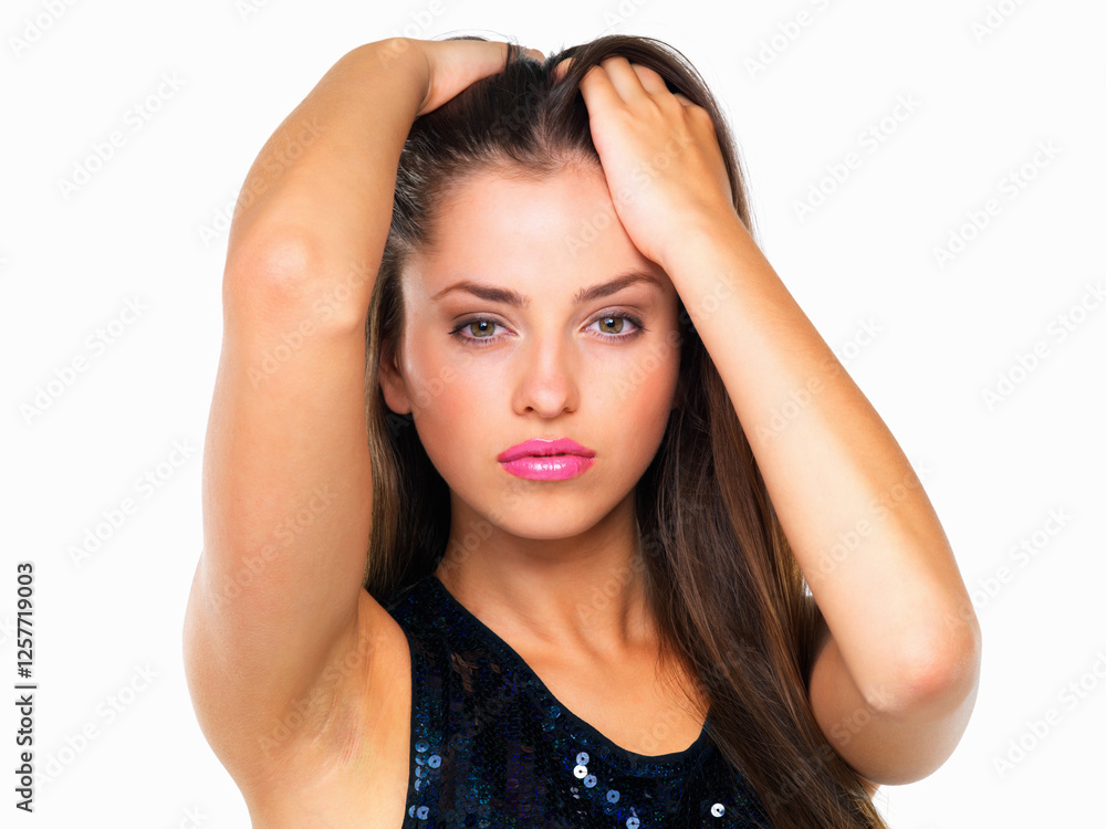 Fototapeta premium Portrait, studio and serious for haircare, woman and cosmetics for healthy hairstyle, confident and beauty. White background, person and treatment with benefits for texture, model and hair in Canada