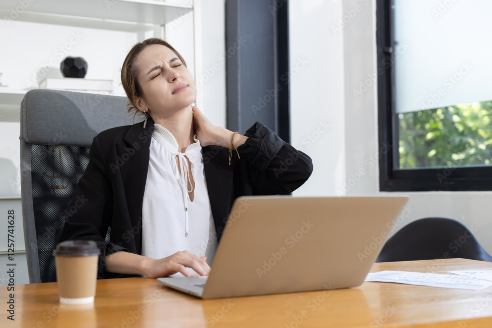 Caucasian businesswoman with neck and shoulder pain suffer from office syndrome Caucasian businesswoman with neck and shoulder pain suffer from office syndrome