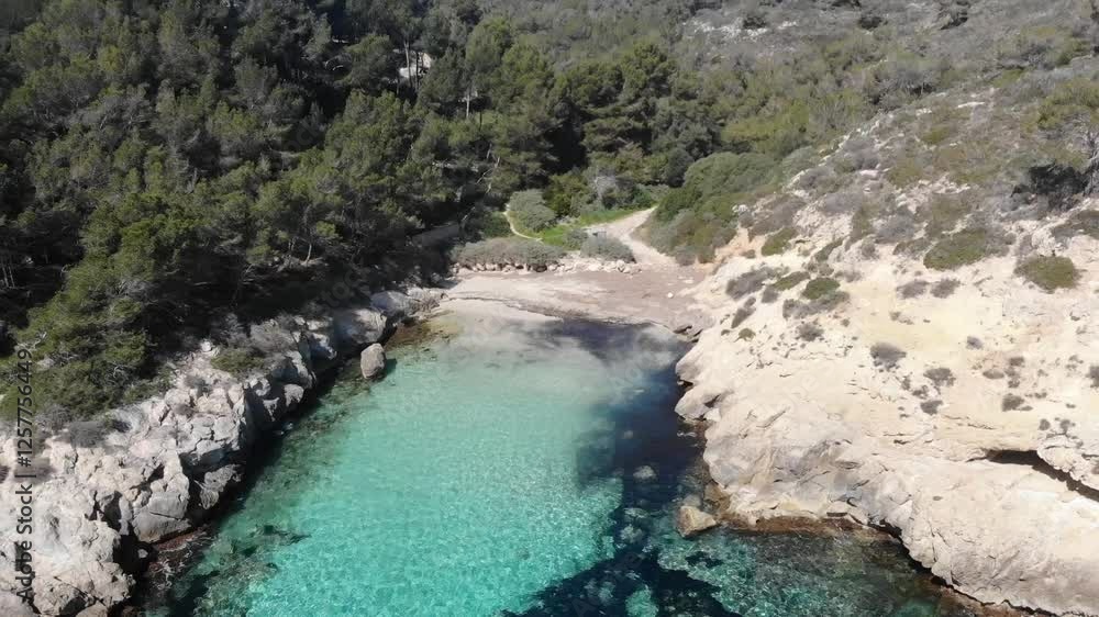Cala Bella Dona, located in Calvià, Mallorca, is a beautiful and peaceful beach with soft golden sand and crystal-clear waters. Surrounded by rocky cliffs and lush vegetation, it’s a perfect spot Cala Bella Dona, located in Calvià, Mallorca, is a beautiful and peaceful beach with soft golden sand and crystal-clear waters. Surrounded by rocky cliffs and lush vegetation, it’s a perfect spot
