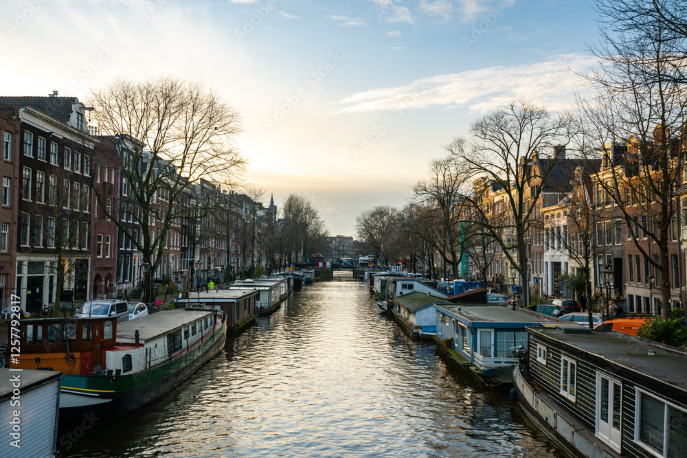 Fototapeta premium Charming Canal View of Amsterdam at Sunset