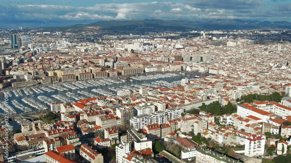 Aerial view aboveMarseille Marina full of sail boats and Yachts in the Mediterranean French Riviera Aerial view aboveMarseille Marina full of sail boats and Yachts in the Mediterranean French Riviera