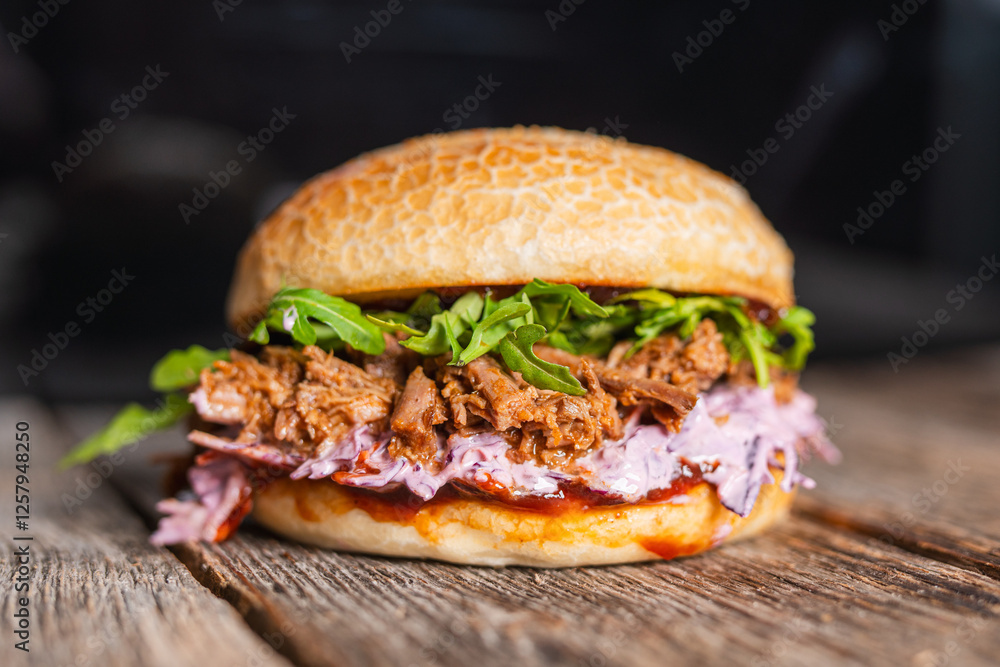 Pulled beef burger with fresh arugula, coleslaw, and barbecue sauce, served on a rustic wooden table. Pulled beef burger with fresh arugula, coleslaw, and barbecue sauce, served on a rustic wooden table.