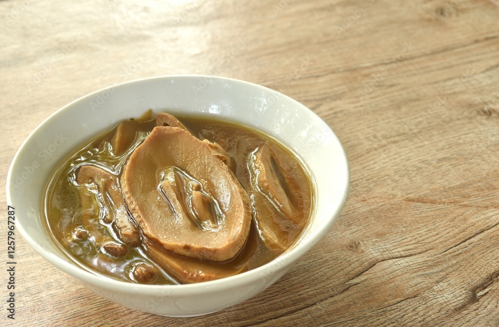 boiled braised slice Chinese bamboo shoot in Chinese herb soup vegetarian food in bowl boiled braised slice Chinese bamboo shoot in Chinese herb soup vegetarian food in bowl