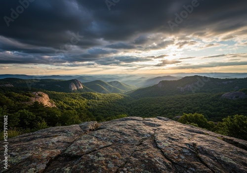 Majestic Mountain Landscape with Rolling Hills and Dramatic Skies at Sunset, Perfect for Nature and Travel Photography photo