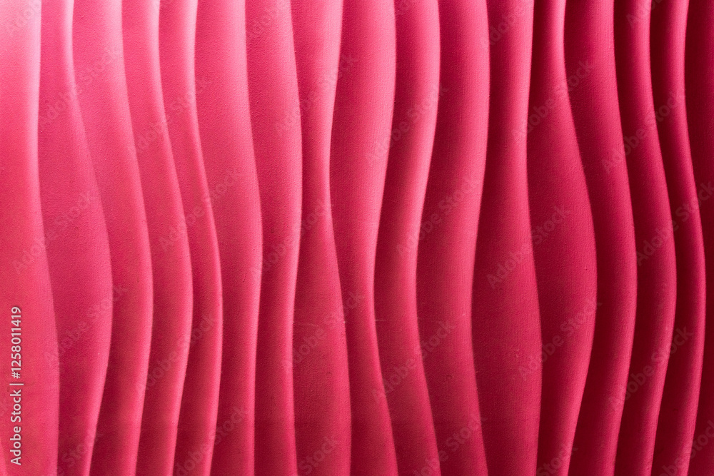 Fototapeta premium Abstract curve of pink wavy vertical lines, background. Fashionable pink stripes texture design. A collection of luxurious soft layers of striped background.