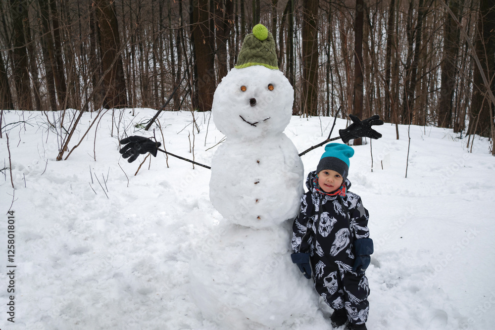 little boy in winter park
