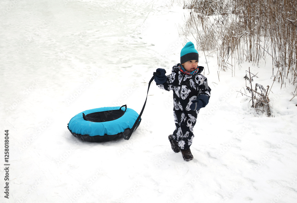 little boy in winter park