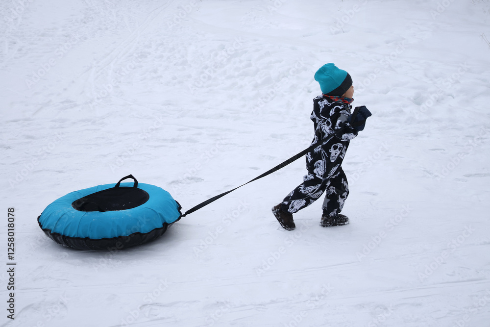 little boy in winter park