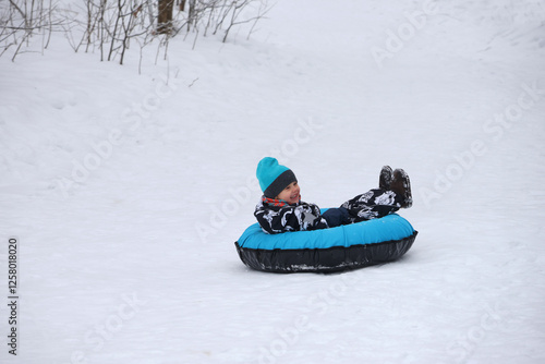 little boy in winter park