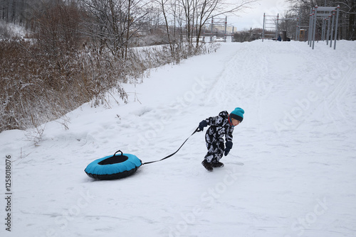 little boy in winter park