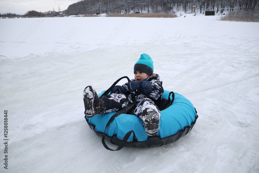 little boy in winter park
