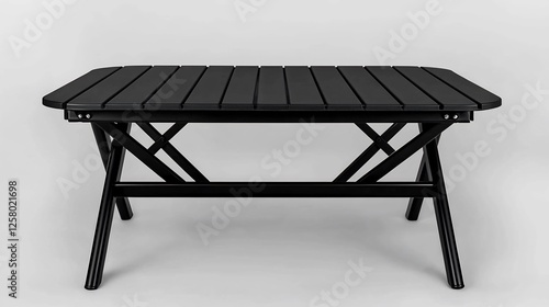 Black rectangular outdoor folding table on plain background photo