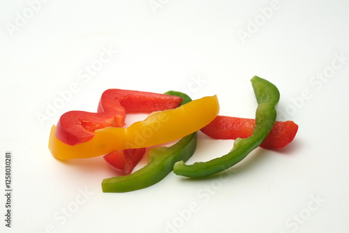 Pepper cut into strips on white background