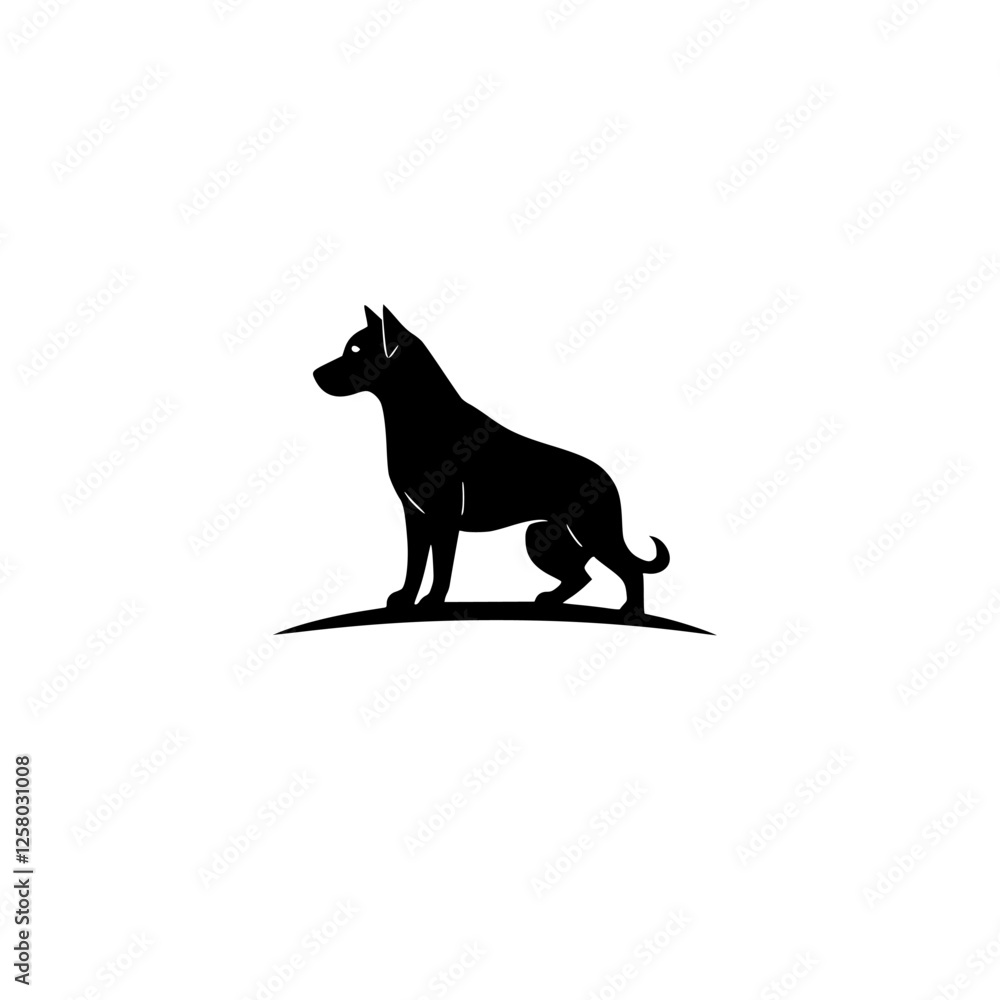 Obraz premium Silhouette of a black dog standing on a tiny mound of grass, looking left.