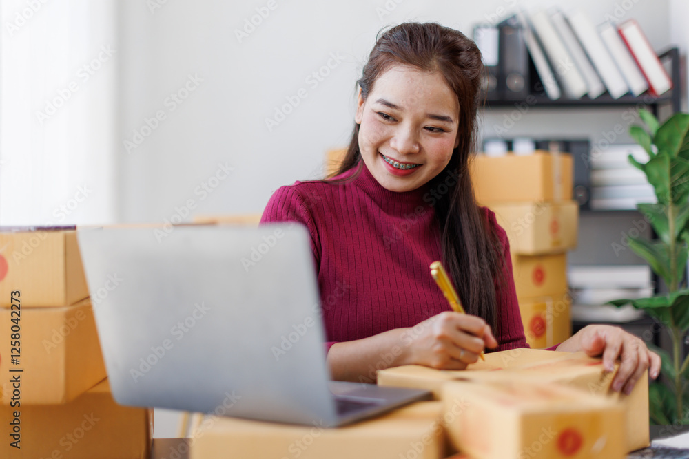 SME entrepreneurs write information on the front of the parcel box and check the order and check the order. Prepare parcels for delivery.
SME entrepreneurs write information on the front of the parcel box and check the order and check the order. Prepare parcels for delivery.
