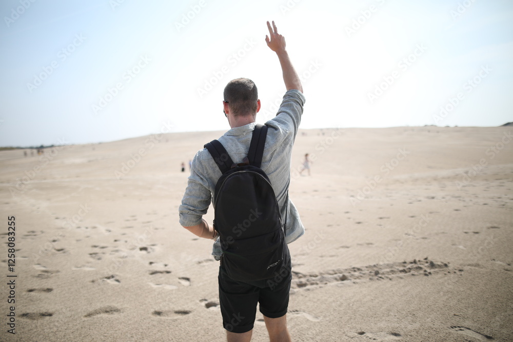 Young man in desert landscape Young man in desert landscape