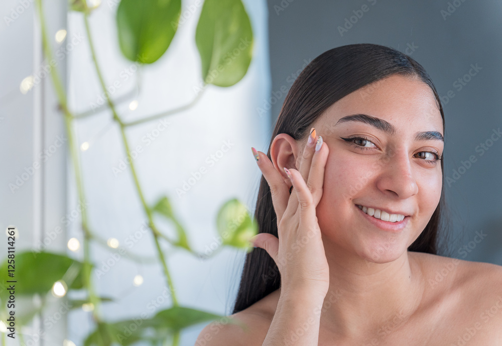 Woman with healthy skin smiling in makeup session Woman with healthy skin smiling in makeup session