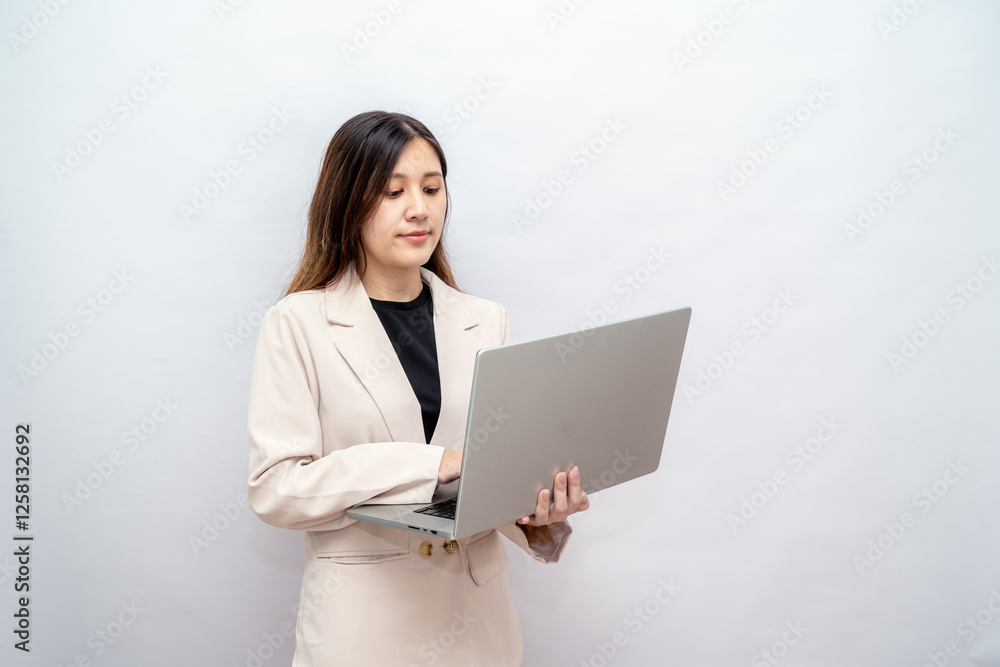 Focused Businesswoman Working Remotely on Technology Focused Businesswoman Working Remotely on Technology