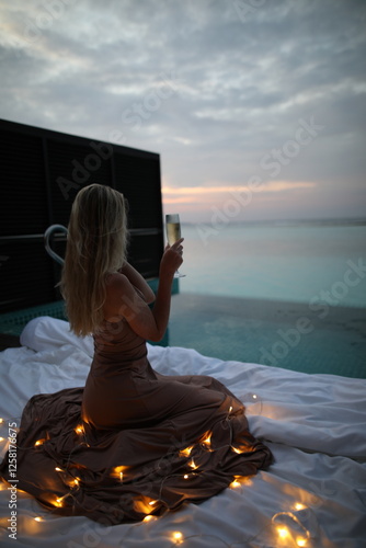 A woman enjoying the sunset in tthe bahamas photo