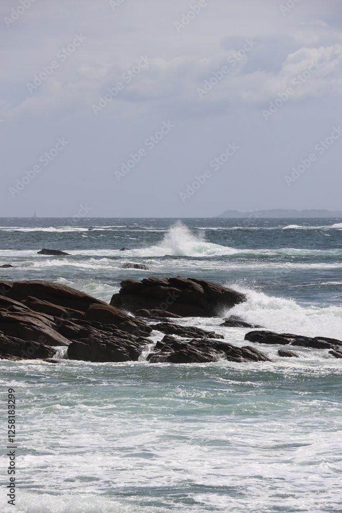 waves crashing on rocks in Quiberon, France