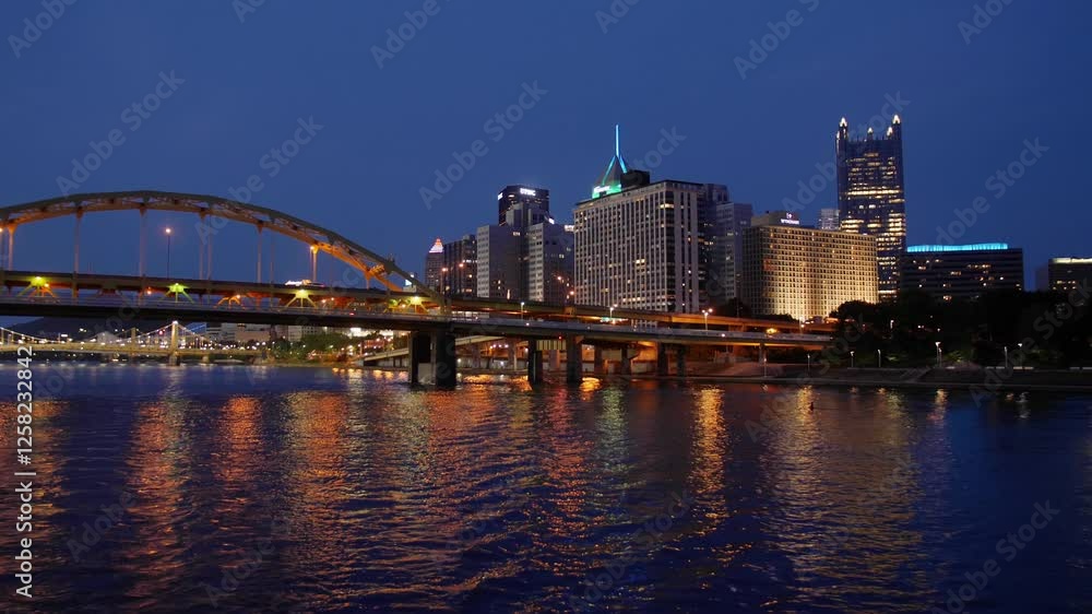 PITTSBURGH - Circa June, 2019 - A nighttime view of the Pittsburgh city skyline as seen from a tour boat on the river. PITTSBURGH - Circa June, 2019 - A nighttime view of the Pittsburgh city skyline as seen from a tour boat on the river.