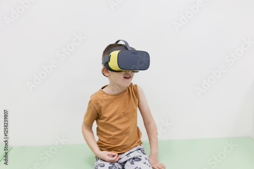 Caucasian boy in vr glasses clinic photo