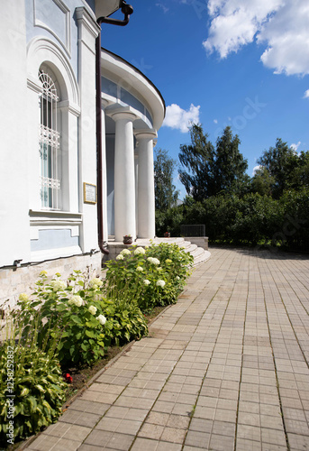 Large white columns against a blue sky entrance to the building