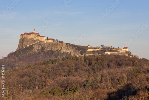 Sunset view of the medieval Regiersburg castle, a famous landmark and tourist spot in Austria photo