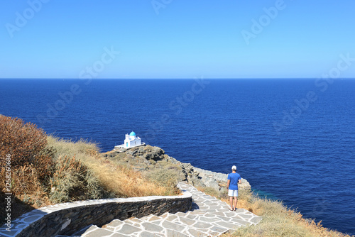 Принти на полотні Traditional Cycladic Church of the Seven Martyrs atop a rocky islet that emerges