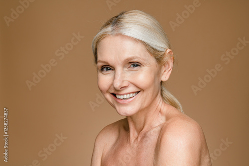 Quadro su tela Headshot of gorgeous beautiful middle-aged woman with pure and healthy skin and
