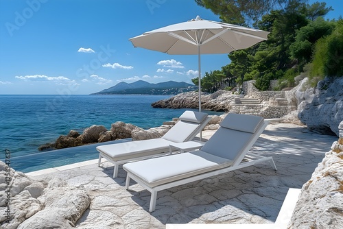 Fototapeta Naklejka Na Ścianę i Meble -  Luxury Mediterranean Beach Loungers with Coastal Mountain View.