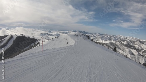 Exciting Winter Scene Of Diverse People Enjoying Skiing On A Snow-covered Ski Slope