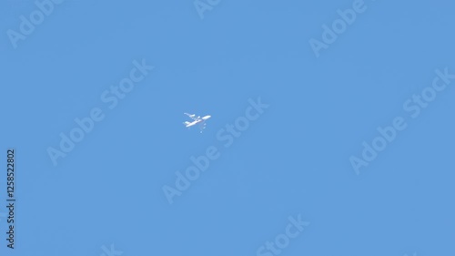 a plane climbing against a clear sky