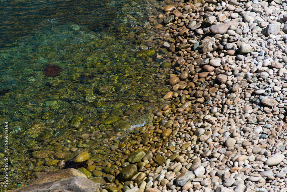high-angle view of the pebble beach at the island high-angle view of the pebble beach at the island