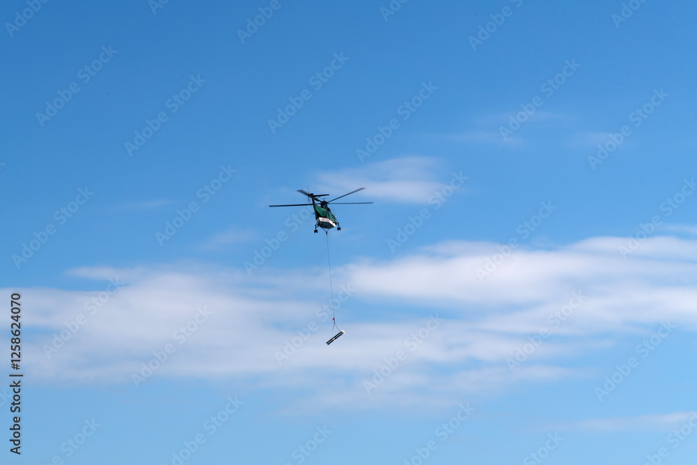 flying helicopter in the blue sky flying helicopter in the blue sky