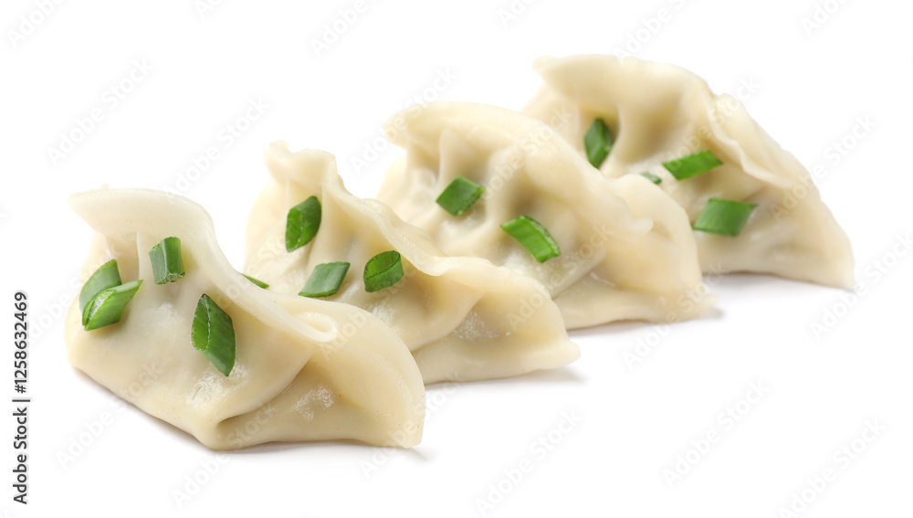 Fresh gyoza dumplings with pieces of green onion isolated on white Fresh gyoza dumplings with pieces of green onion isolated on white