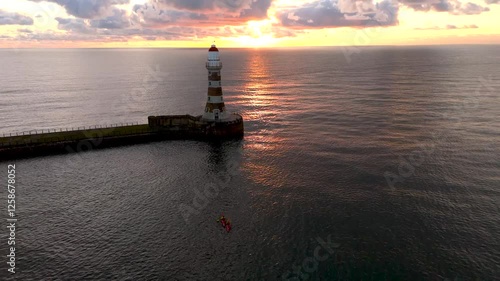 Roker Lighthouse canoeists sunrise HD photo