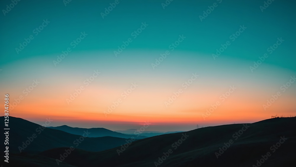 Mountains silhouetted against a gradient sky Mountains silhouetted against a gradient sky