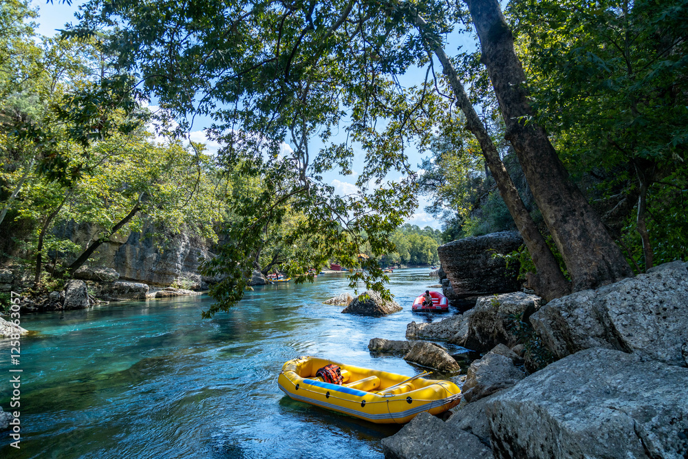 Obraz premium View of Koprulu Canyon. Boat for rafting on the Koprucay river with turquoise cold water. Antalya, Turkey. Popular tourist attraction.