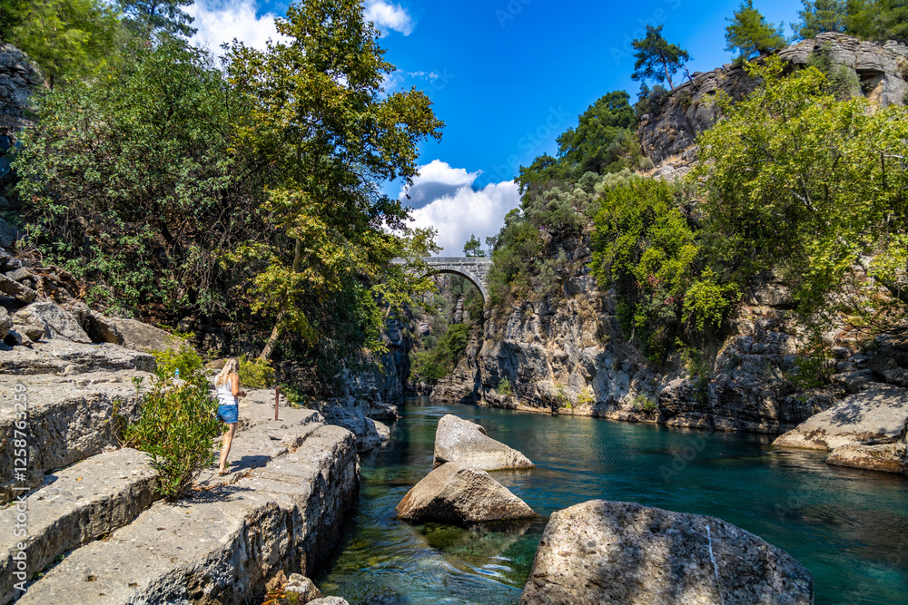 Fototapeta premium The Roman bridge at Koprulu Canyon, Antalya, Turkey/ Popular tourist attraction. 
