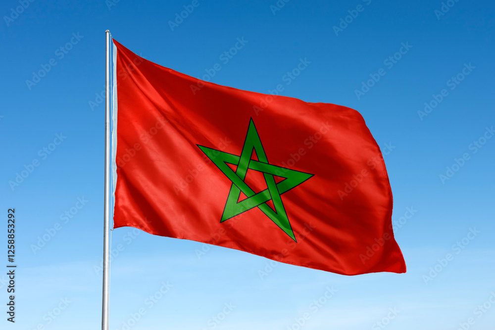 Waving Morocco flag, national symbol, blue sky Waving Morocco flag, national symbol, blue sky