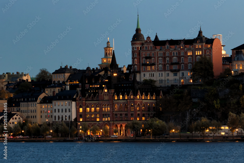 Fototapeta premium Cityscape during sunset at the harbor in the capital of Sweden - Stockholm
