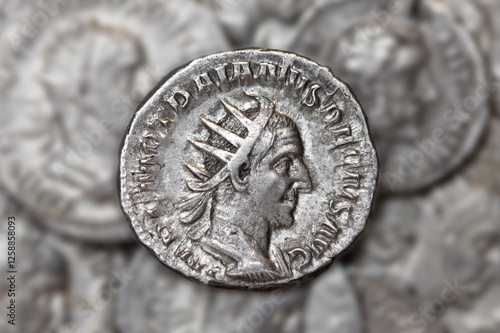 Obraz na płótnie Old Roman coin of caesar Trajan Decius Antoninianus with blurry background w salonie