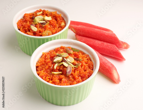 carrot halwa a dessert made from carrot, milk, sugar and nuts photo