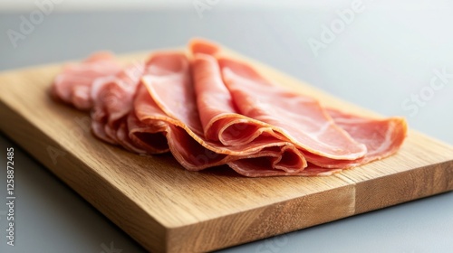 Sliced ham on wooden board photo